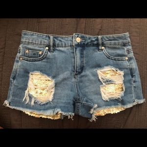 Distressed jean shorts with sequins